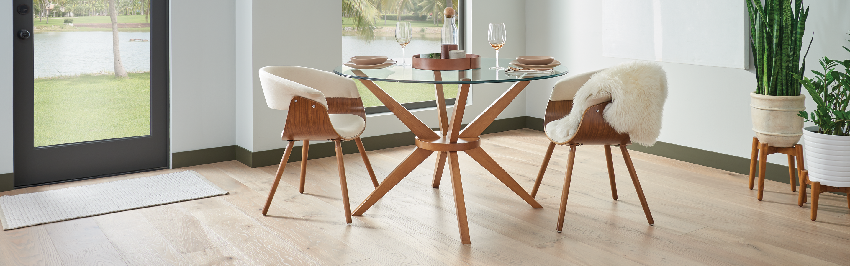 modern dining room with light oak hardwood floors and wood accents